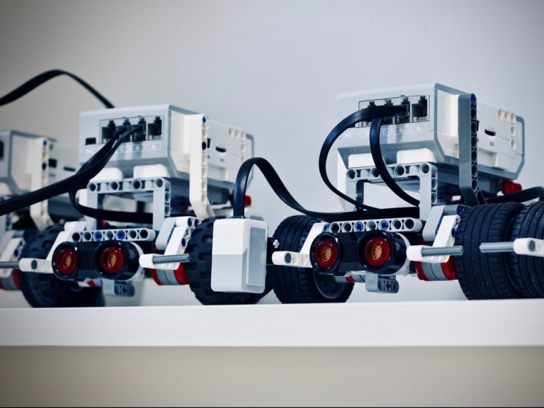 two white and black electronic device with wheels