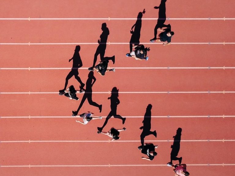 group of people running on stadium