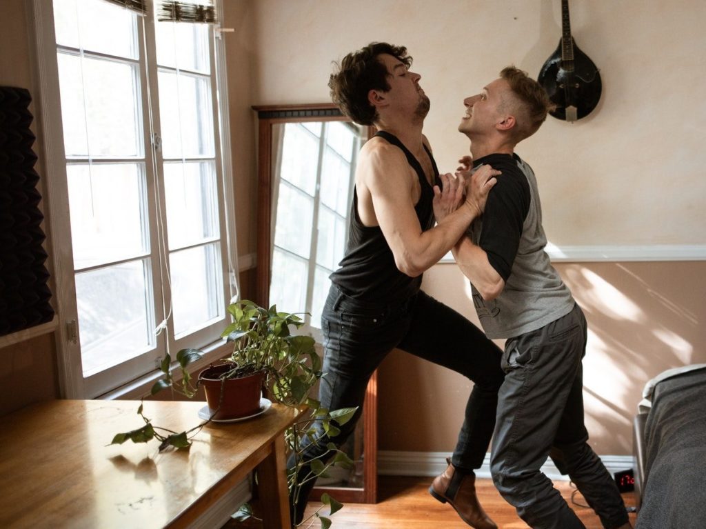 Men Pushing Each Other
