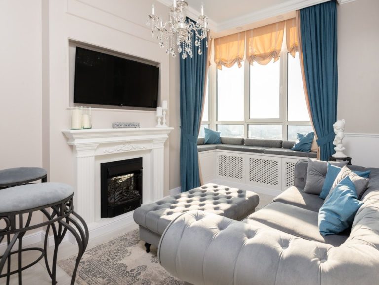 Modern room interior with furniture and TV set