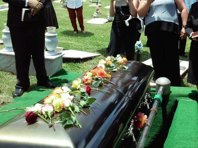 group of people attending burial