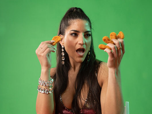 Leah looking at a chicken nugget tcm  e