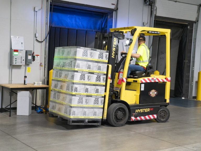 Man Riding on Yellow Forklift