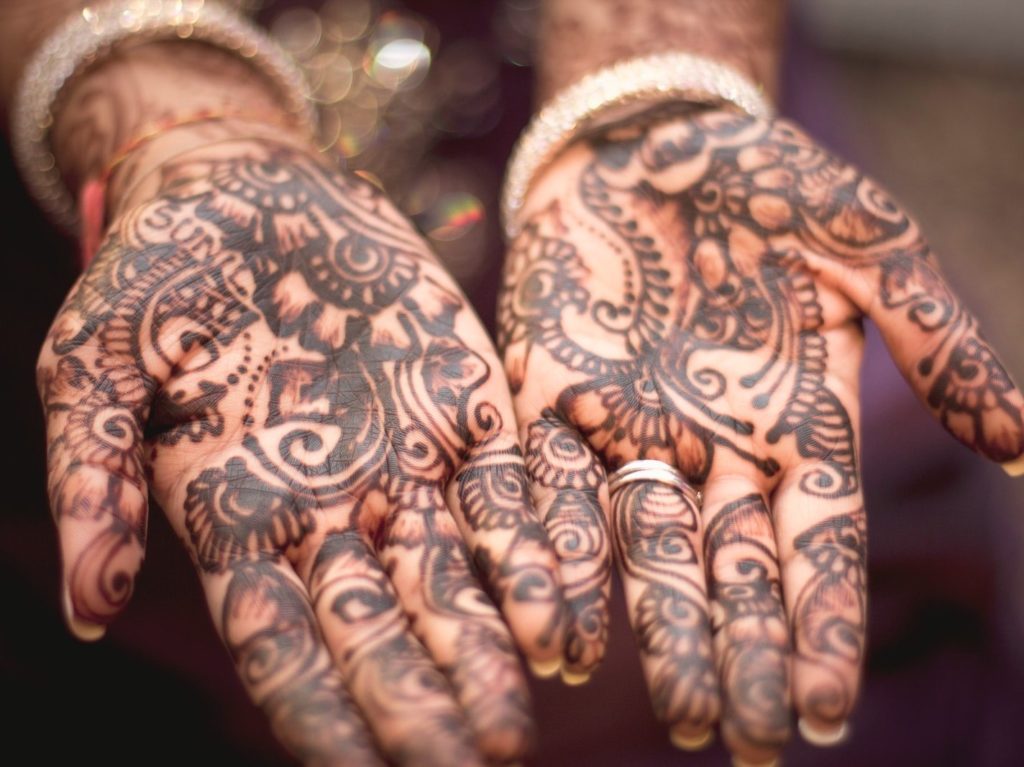 person showing hand tattoos