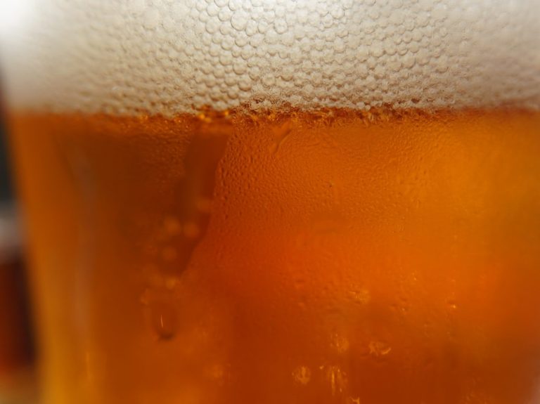 clear drinking glass with beer