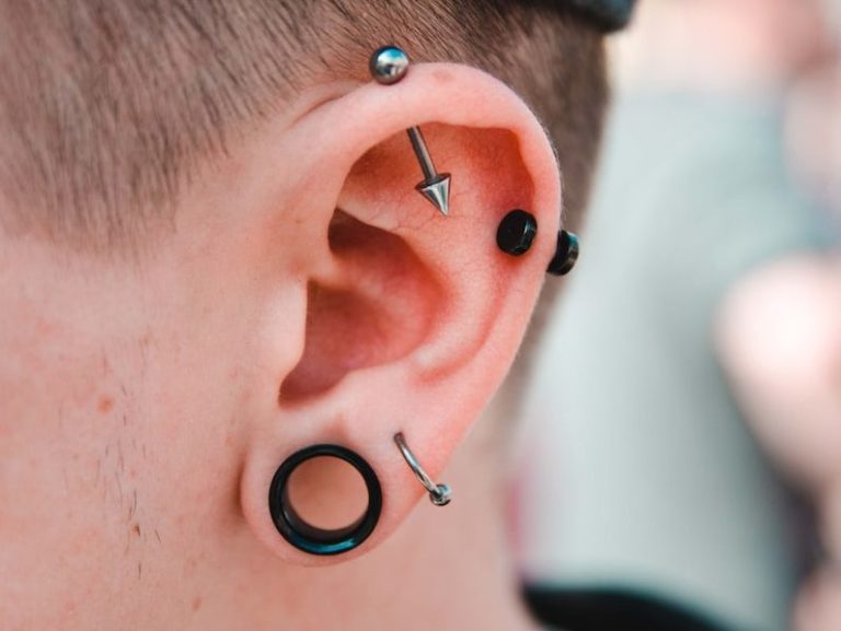 person wearing stud earrings