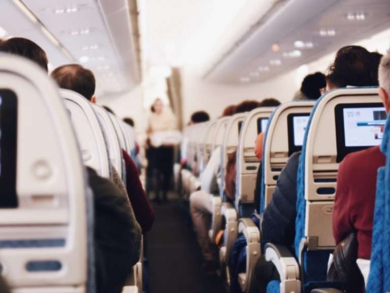 shallow focus photography of people inside of passenger plane