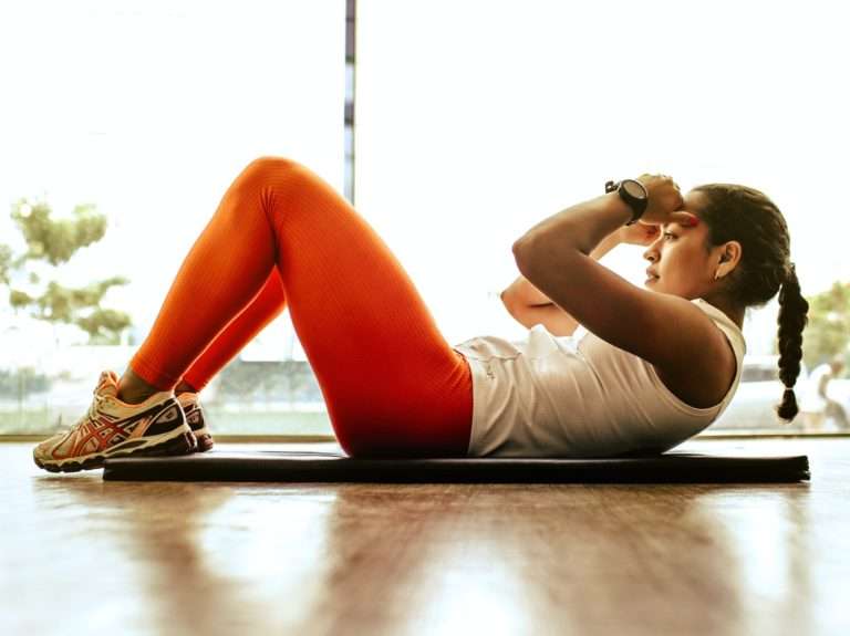 woman exercising indoors