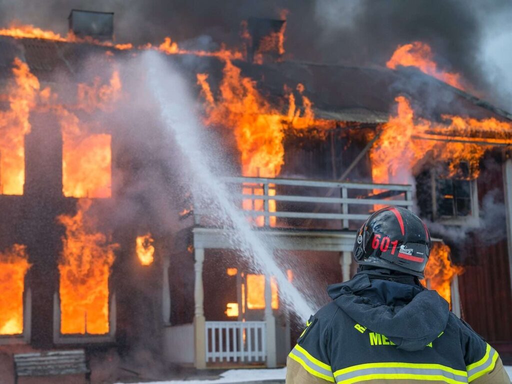 fireman watering fire