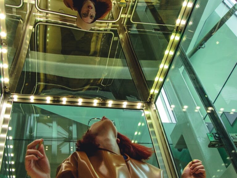 woman looking at mirror