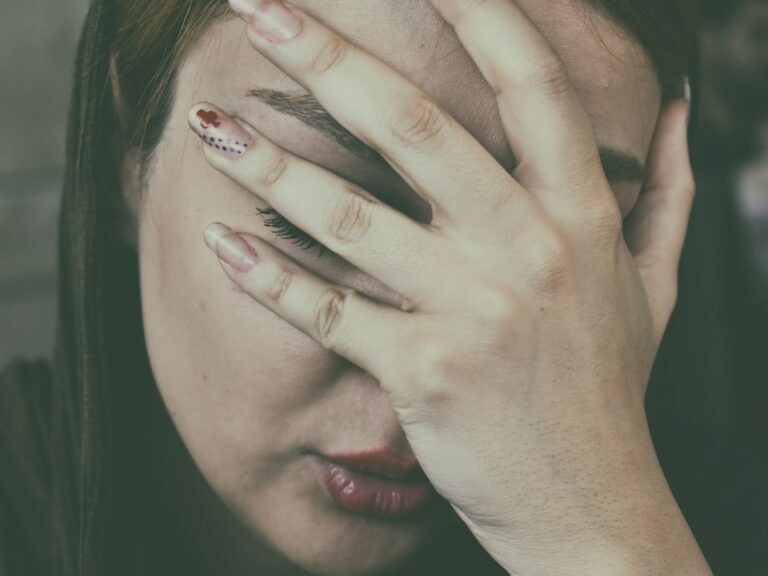woman's hand on face