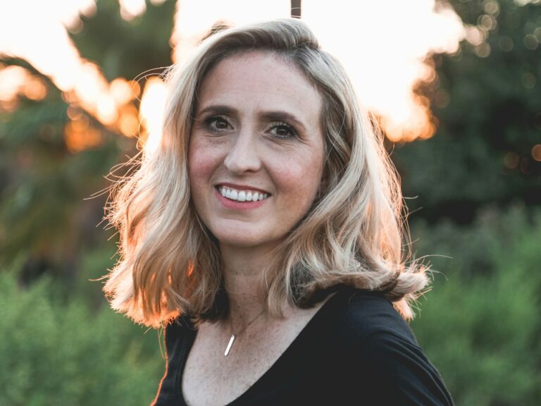 smiling woman in shallow focus photography
