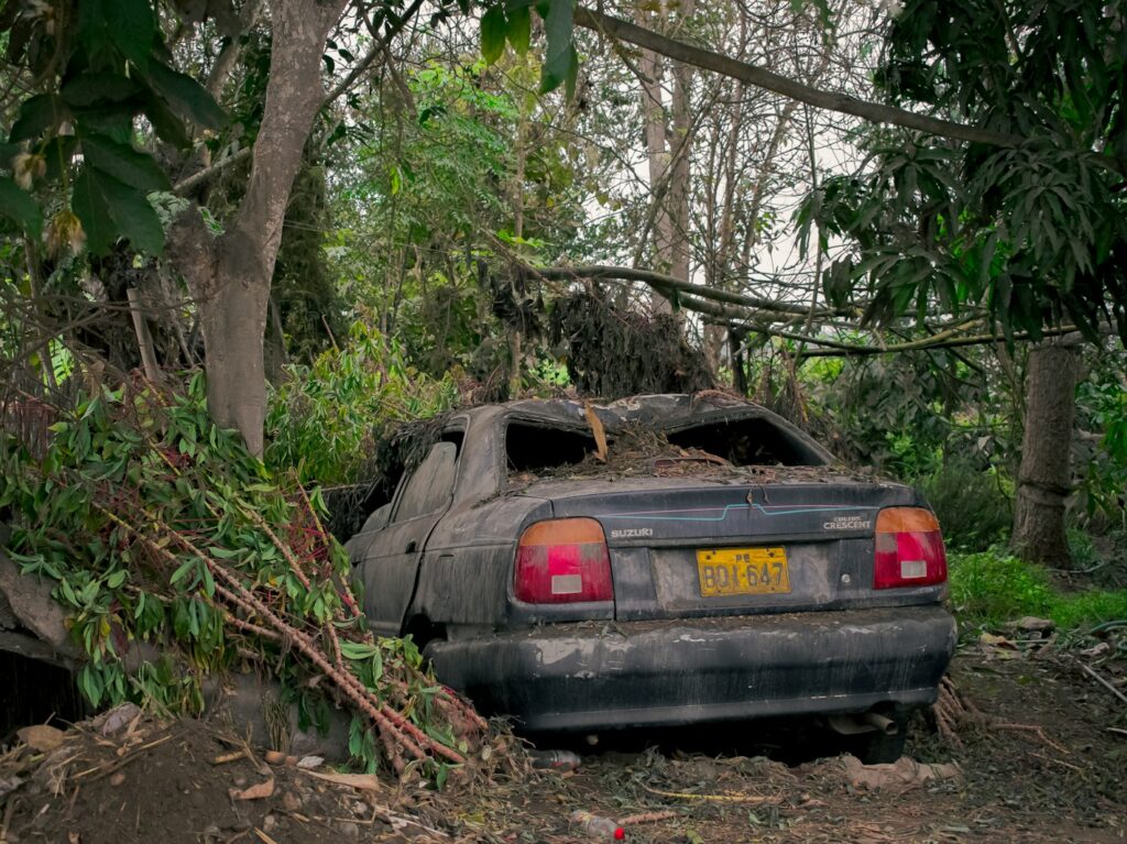a car that is sitting in the dirt